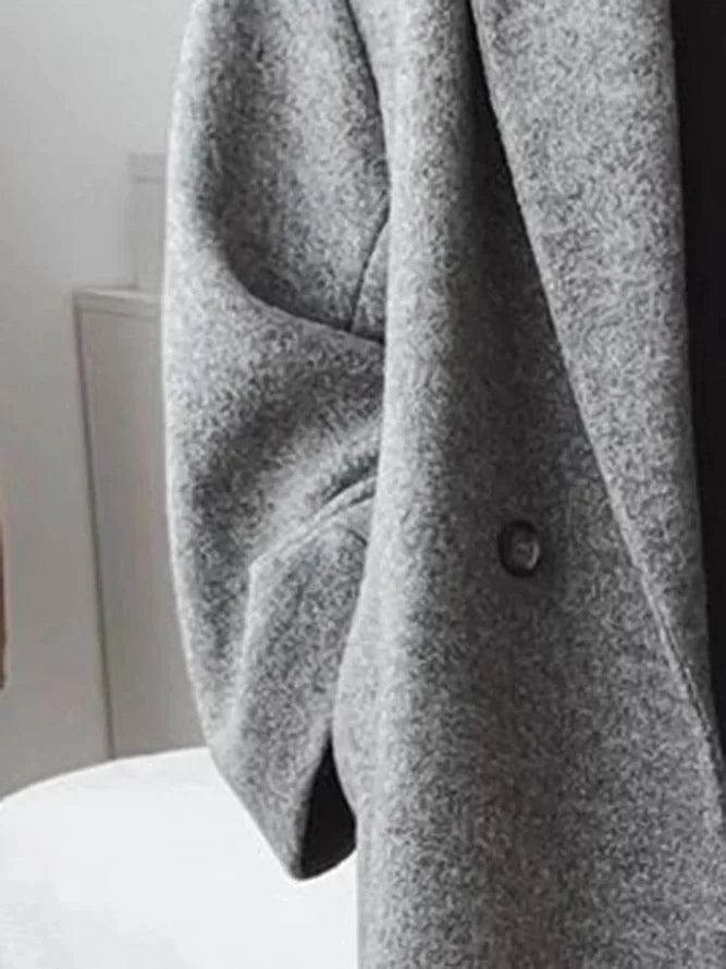Manteau long élégant à double bouton et coupe ample
