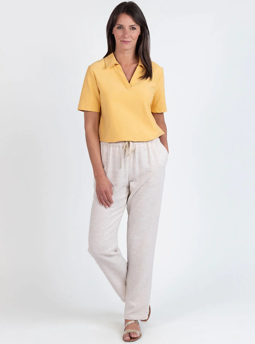 Polo femme en maille de coton jaune épicé