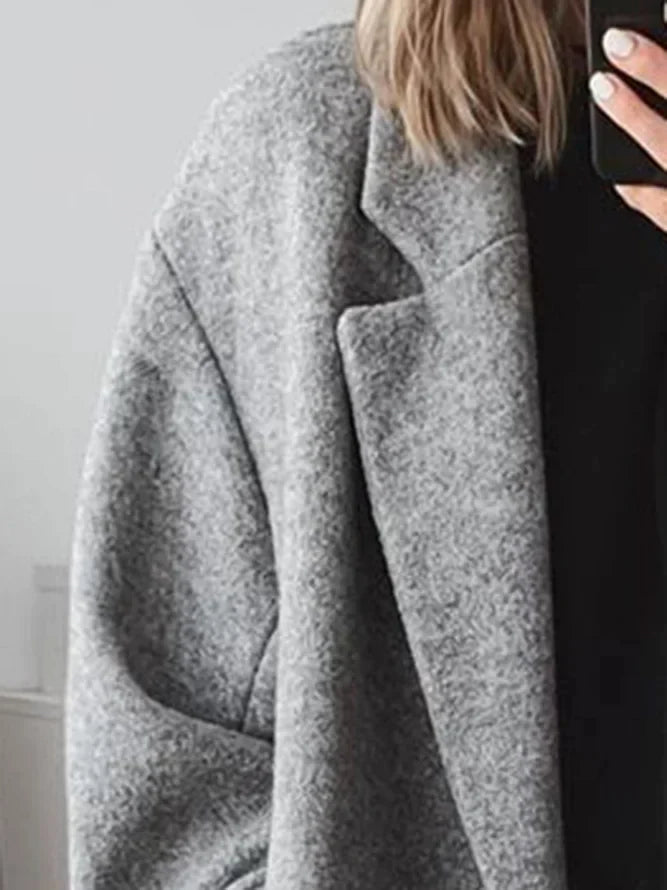 Manteau long élégant à double bouton et coupe ample